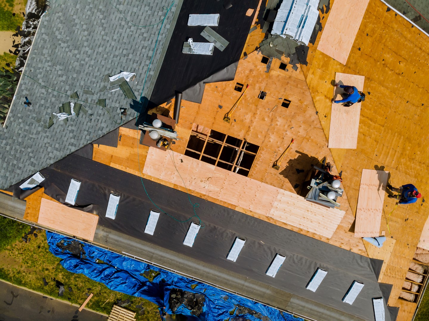 Workers installing a new roof